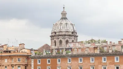 a building with a tower on top of it at Rental In Rome Ancient View in Rome