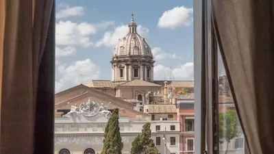 a view of a cathedral from a window at Rental In Rome Ancient View in Rome