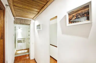 a hallway in a house with a painting on the wall at Arenula Luxury Apartment in Rome