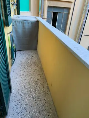 an empty hallway of a building with a counter top at La Casetta del Flaminio a Roma Centro in Rome