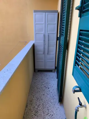 a hallway with a white door and a window at La Casetta del Flaminio a Roma Centro in Rome