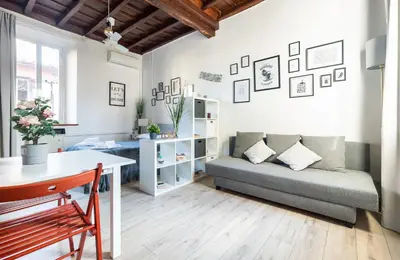 a living room with a couch and a table at Cozy studio Campo de Fiori in Rome