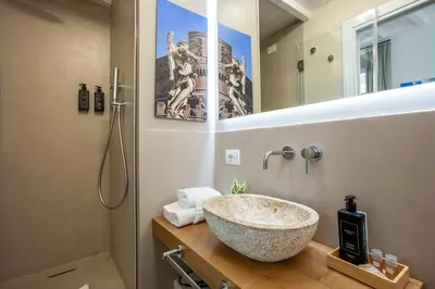 a bathroom with a large bowl sink on a counter at Pantheon Suites Rome 2 in Rome