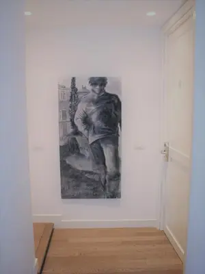 a painting of a man on a wall in a room at Relais Fori Imperiali in Rome