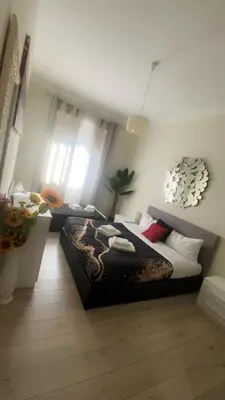 a bedroom with two beds in a room at Vatican Sofia house in Rome