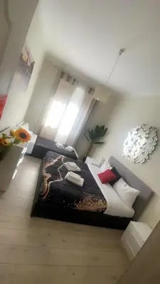 a bedroom with a large bed in a room at Vatican Sofia house in Rome