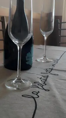 two wine glasses sitting on top of a table at Vatican Sofia house in Rome