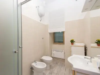 a bathroom with a toilet and a sink at Apartment Aurelia by Interhome in Rome