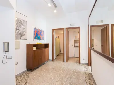 a hallway with white walls and a room with a desk at Apartment Aurelia by Interhome in Rome