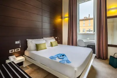 a bedroom with a large bed and a window at Navona Stay in Rome