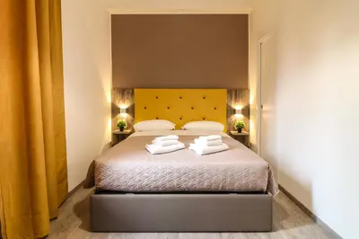 a bedroom with a bed with two white towels on it at BorgoNove in Rome