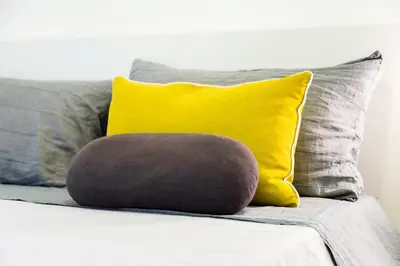 a pillow sitting on top of a couch with pillows at Vasari's Home in Rome