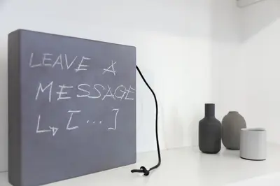 a chalk board with the words leave measy left at Vasari's Home in Rome