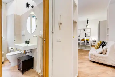 a bathroom with a sink and a toilet in a room at Vasari's Home in Rome