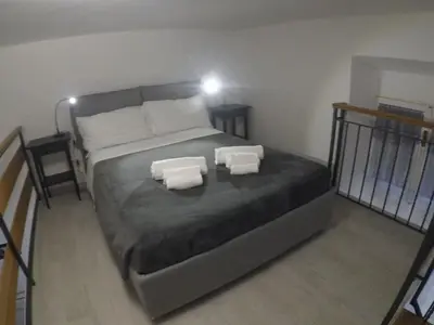 a bedroom with a bed with two pillows on it at Your home near to the Vatican in Rome