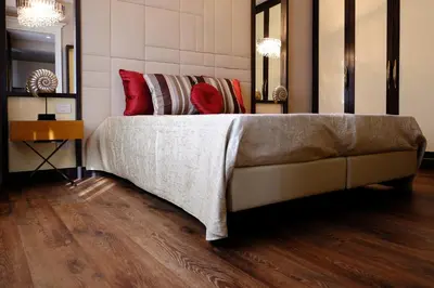a bed with red pillows on it in a room at San Pietro Rhome in Rome