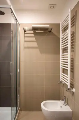 a bathroom with a sink and a glass shower at Four Elements in Rome