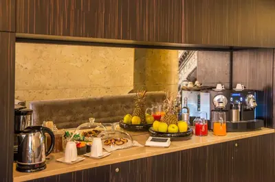 a table with food on it in a hotel room at Campo Marzio Luxury Suites in Rome