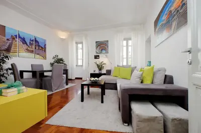 a living room with a couch and a table at LUXURY APARTMENT VATICANO-S'PETER BASILICA - NETFLIX Wifi - AirCond in Rome