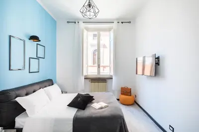 a bedroom with a bed and a window at A World Aparts - 32 Modena in Rome