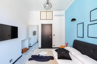a living room with a couch and a tv at A World Aparts - 32 Modena in Rome
