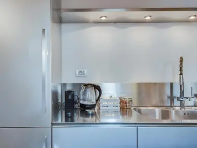a kitchen with a sink and a counter top at Loft in Trastevere in Rome