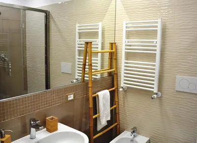 a bathroom with a sink and a mirror at Trastevere Boulevard in Rome