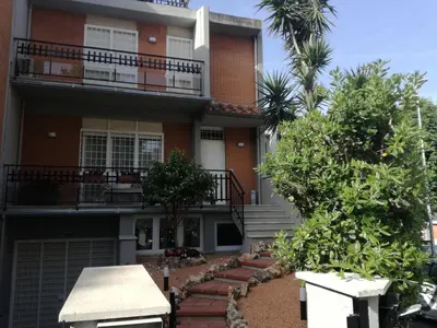a house with trees in front of it at La camelia bianca in Rome
