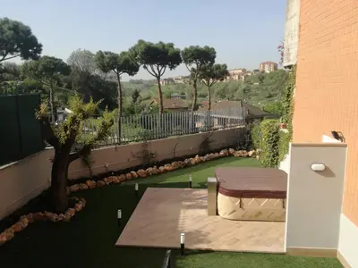 a view from the balcony of a house with a table at La camelia bianca in Rome