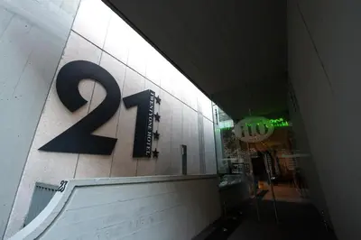 a sign on the side of a building with the number at Twentyone Hotel in Rome