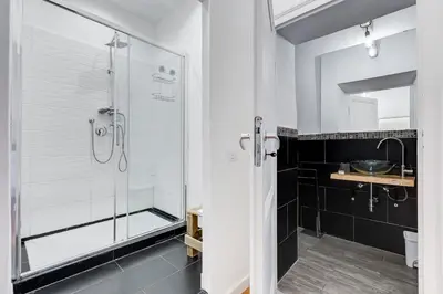 a bathroom with a shower and a sink at BMGA l Central Holiday House 2Bdr near Vatican in Rome