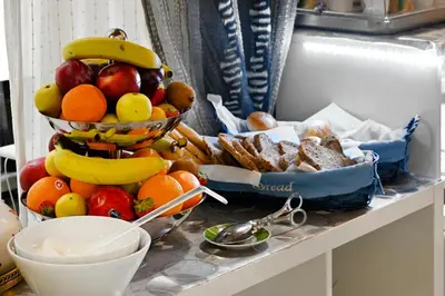a pile of fruit and bread on a counter at Roman Nights in Rome