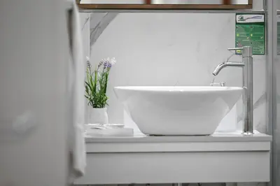 a white sink sitting on a counter in a bathroom at Roman Nights in Rome