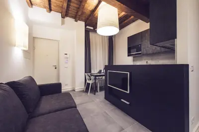 a living room with a couch and a table at Dolcevita Apartments in Rome