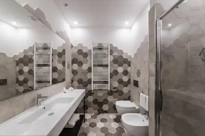 a bathroom with a sink and a toilet and a tub at Dolcevita Apartments in Rome