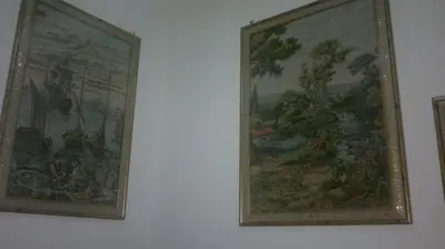 two pictures hanging on a white wall at Hotel Stadler 2 in Rome