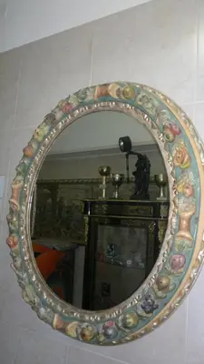 a large decorative mirror on a wall at Hotel Stadler 2 in Rome