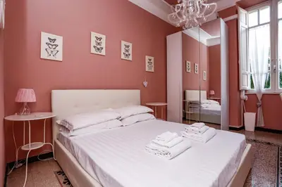 a bedroom with a bed with towels on it at Pamphili Park Romantic Retreat in Rome