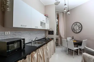 a kitchen with a sink and a counter top at Pamphili Park Romantic Retreat in Rome