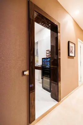 a mirror on a wall in a living room at The Brunetti - Luxury serviced apartment in Rome