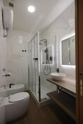 a bathroom with a shower and a toilet and a sink at B&B A Picture of Rome in Rome