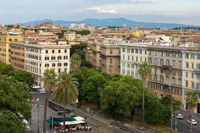 a view of a city with palm trees and buildings at B&B A Picture of Rome in Rome