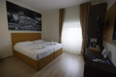 a bedroom with a large bed and a window at B&B A Picture of Rome in Rome