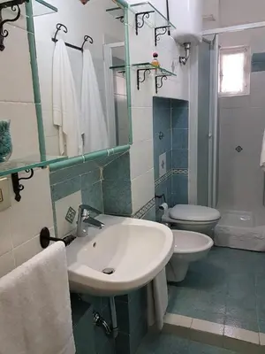 a bathroom with a sink and a toilet at APPARTAMENTO SIMONE DUE in Rome