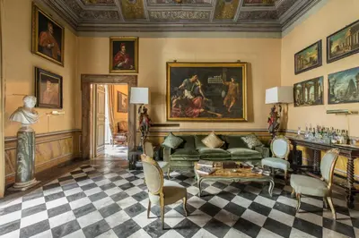 a living room with a couch and a table at Residenza Ruspoli Bonaparte in Rome