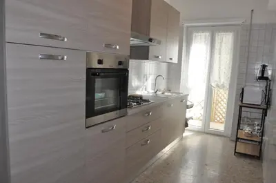 a kitchen with a stove and a sink at RELAX INN VATICAN in Rome