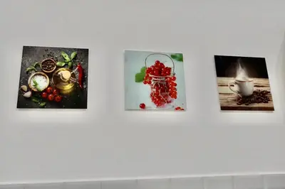 a group of four pictures hanging on a wall at Home Vatican Star in Rome