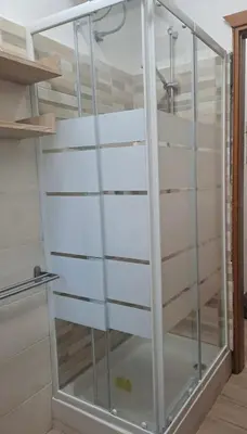 a glass closet in a room with a staircase at Home Vatican Star in Rome