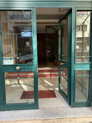 an open door of a building with glass windows at Home Vatican Star in Rome