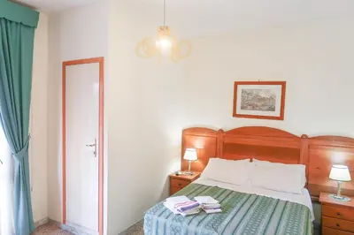 a bedroom with a bed with two towels on it at The Condottieri in Rome